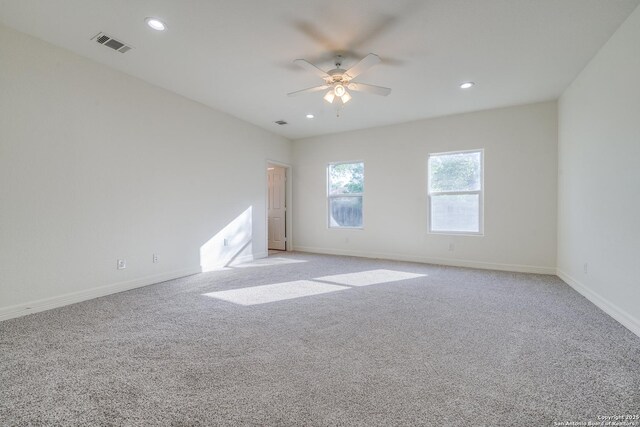 5023 Stockman Dr, San Antonio, TX 78247 - unfurnished room with visible vents, ceiling fan, light carpet, and baseboards