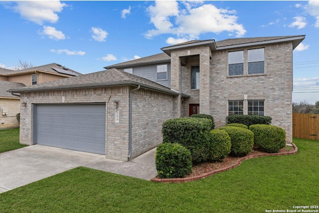 view of front of property with a front lawn and a garage