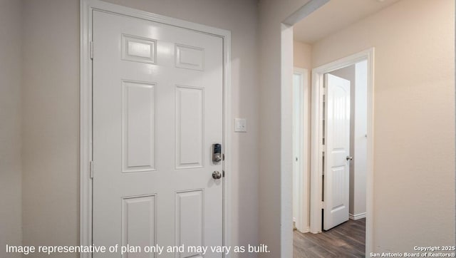 doorway with dark hardwood / wood-style flooring