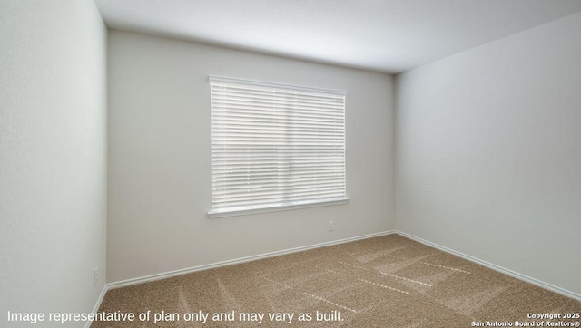 empty room featuring carpet flooring and a healthy amount of sunlight