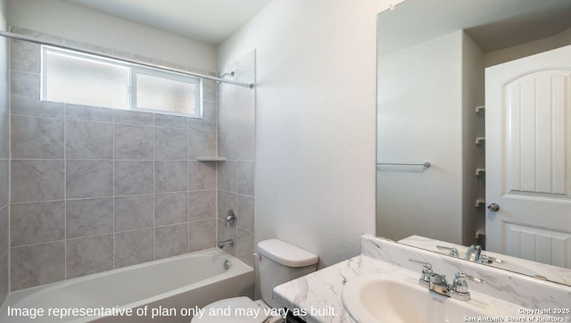 full bathroom with toilet, vanity, and tiled shower / bath combo