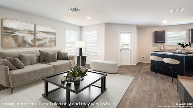 living room with light hardwood / wood-style flooring