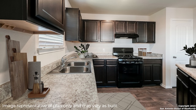 kitchen featuring dark brown cabinets, sink, dark wood-type flooring, and black gas range