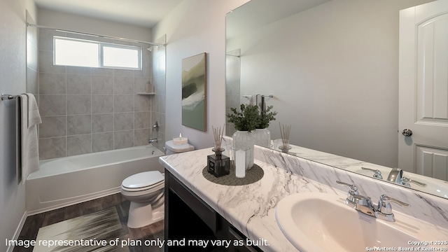 full bathroom featuring wood-type flooring, vanity, toilet, and tiled shower / bath