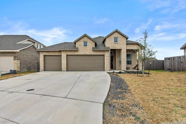 view of front of house with a front yard and a garage