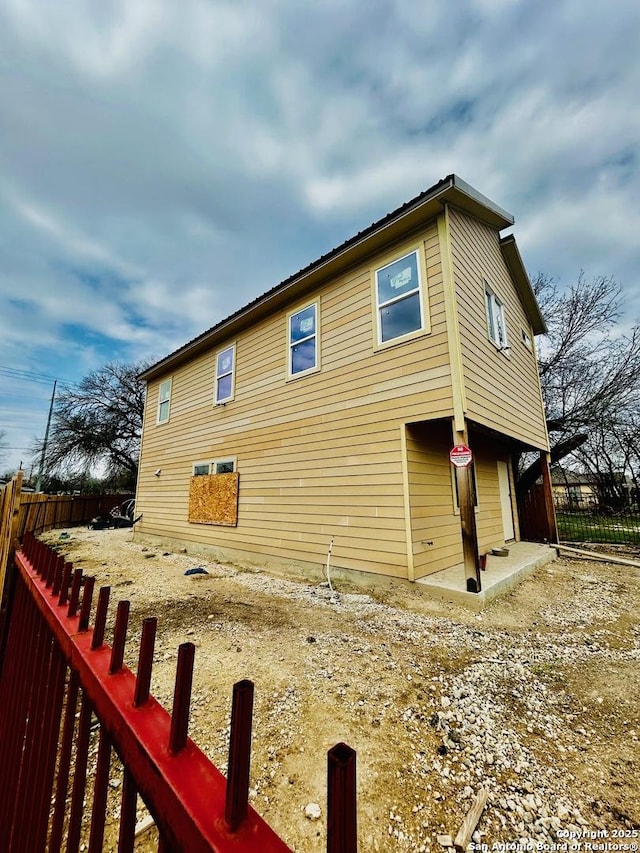 view of side of property featuring a patio