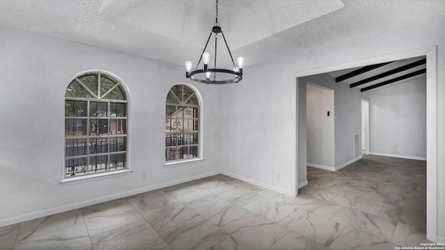 unfurnished dining area with a textured ceiling, beamed ceiling, and a notable chandelier