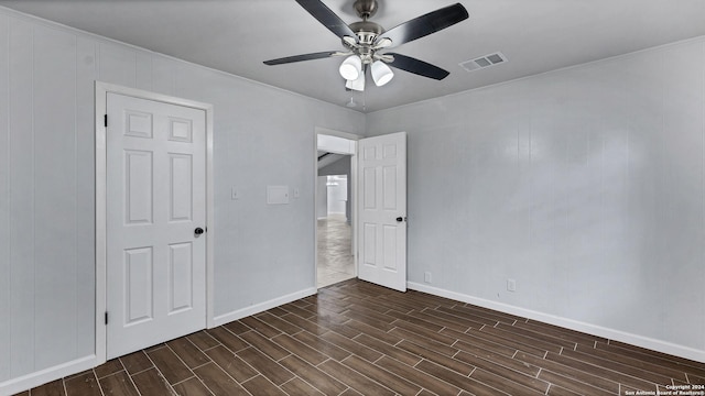 unfurnished bedroom with crown molding and ceiling fan