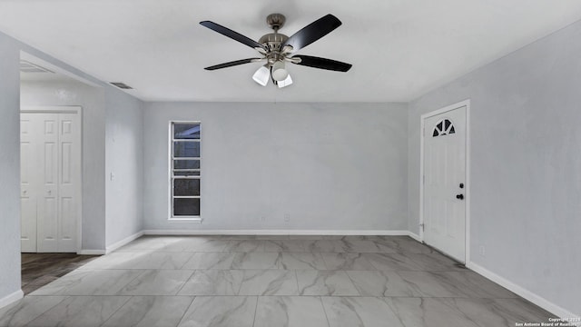 unfurnished room with ceiling fan