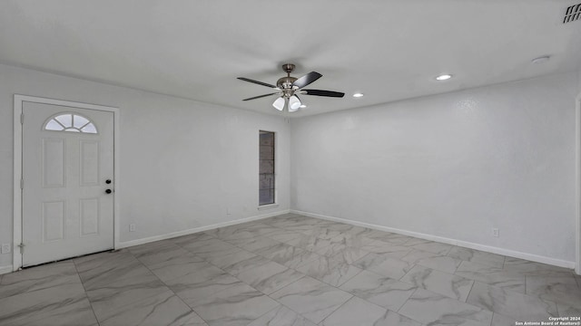 foyer entrance with ceiling fan