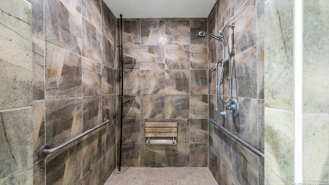 bathroom with tiled shower