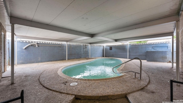 view of swimming pool featuring a patio area