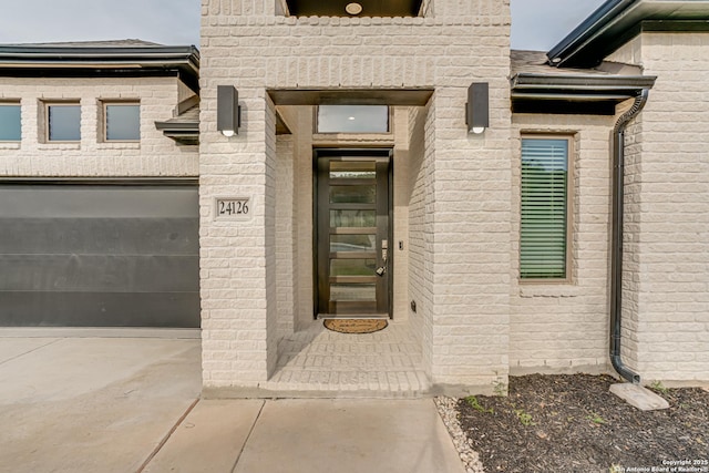 doorway to property featuring a garage