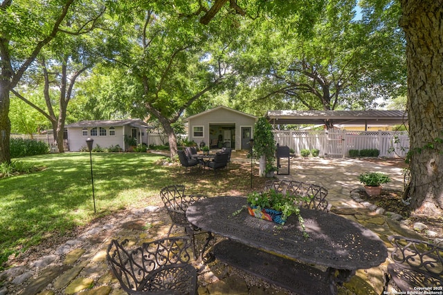 view of yard with a patio area and an outdoor structure