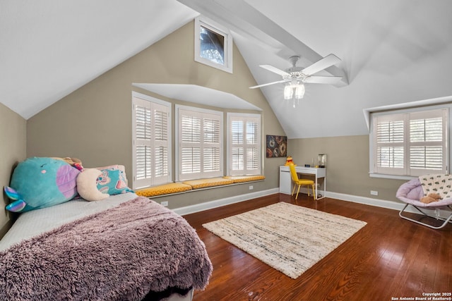 bedroom with dark wood-style floors, multiple windows, vaulted ceiling, and baseboards