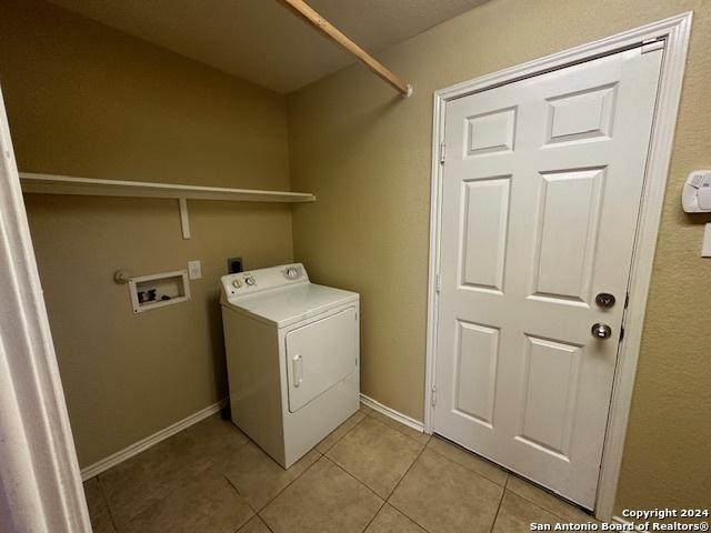 washroom with light tile patterned floors and washer / clothes dryer