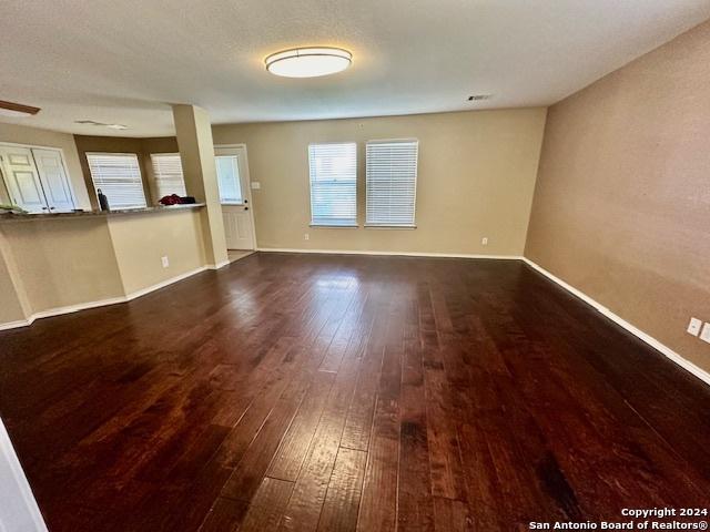 interior space with dark hardwood / wood-style floors