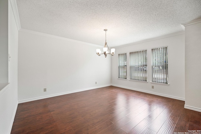 unfurnished room with a textured ceiling, an inviting chandelier, dark hardwood / wood-style flooring, and ornamental molding