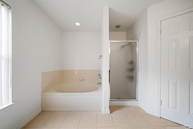 bathroom featuring shower with separate bathtub and tile patterned floors