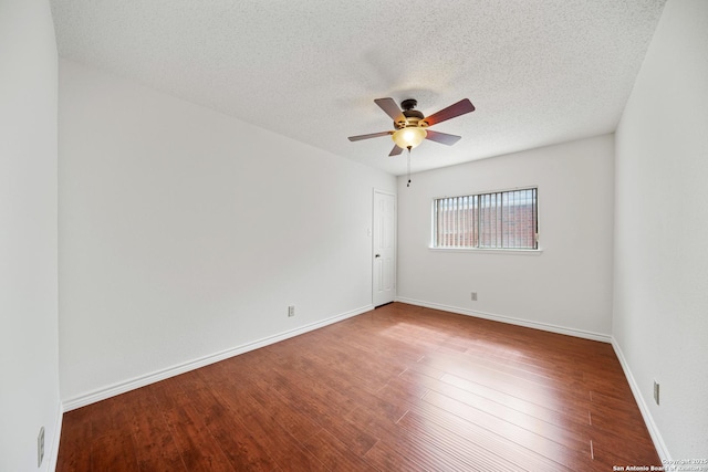 spare room featuring hardwood / wood-style floors, ceiling fan, and a textured ceiling