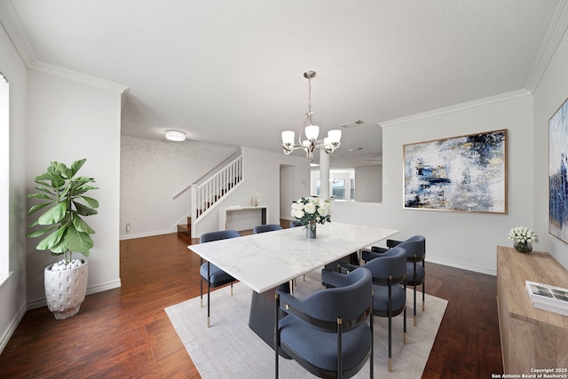 dining room with a textured ceiling, a chandelier, crown molding, and dark hardwood / wood-style floors