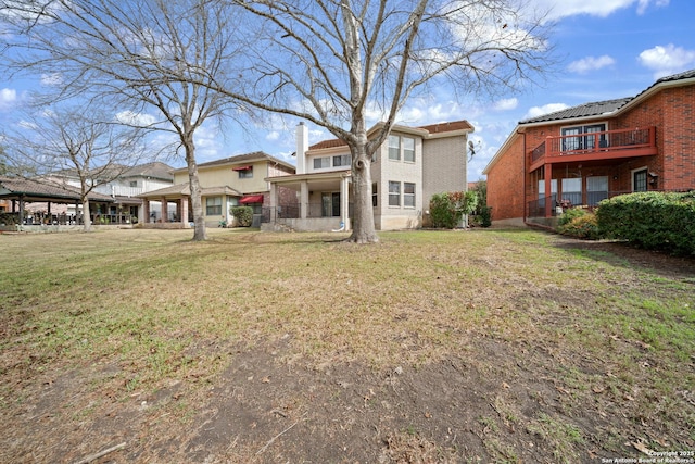 rear view of house with a lawn