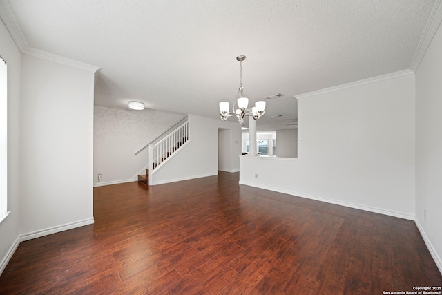 interior space featuring a chandelier, dark wood-type flooring, and ornamental molding