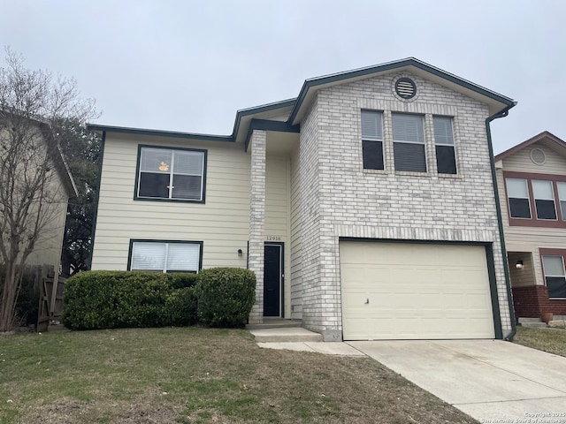 view of front of property with a front yard, concrete driveway, and an attached garage