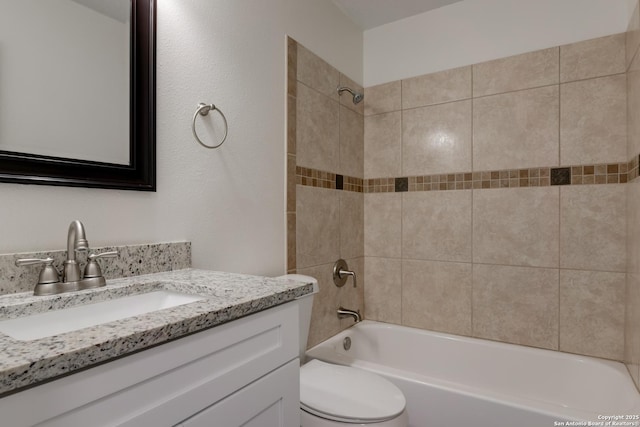 bathroom featuring shower / washtub combination, vanity, and toilet