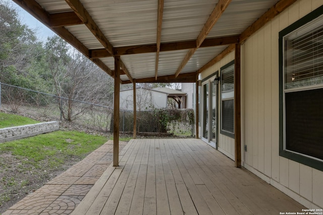 deck with a fenced backyard