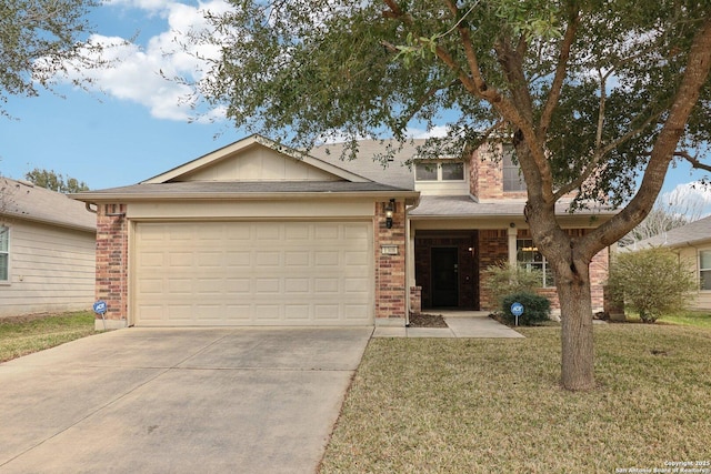 view of front of house featuring a garage and a front lawn