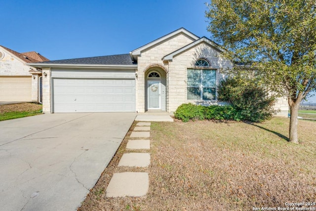 ranch-style house with a garage and a front lawn