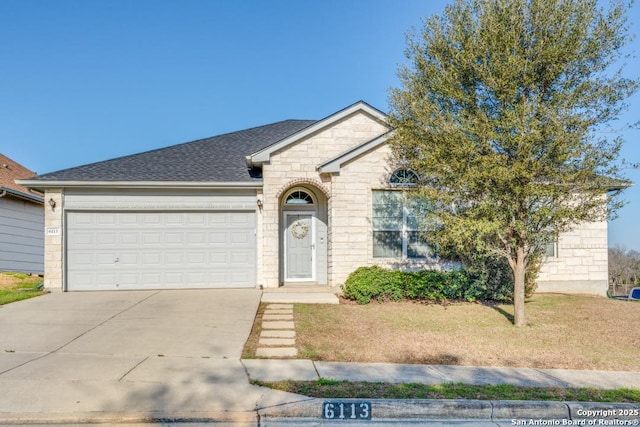 ranch-style home with a front yard and a garage