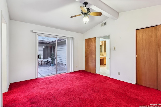 unfurnished bedroom featuring visible vents, a ceiling fan, lofted ceiling with beams, access to outside, and carpet floors