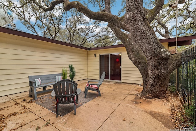 view of patio / terrace featuring fence