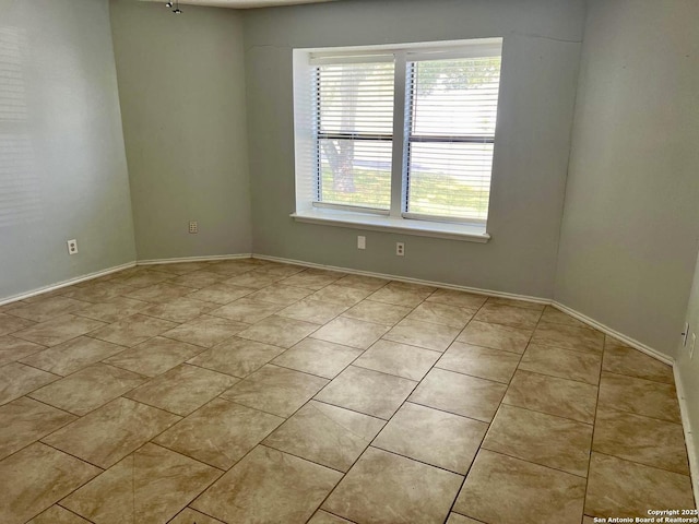 view of tiled spare room