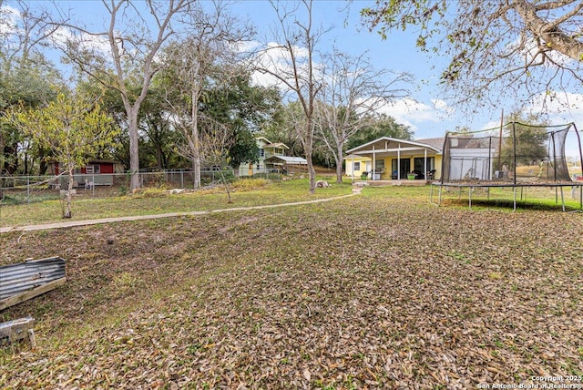 view of yard featuring a trampoline