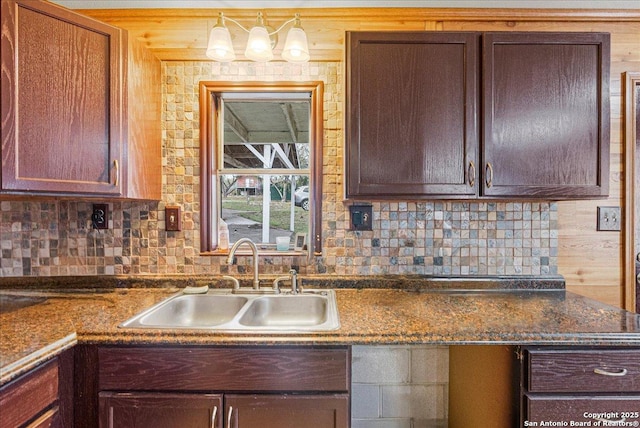 kitchen featuring sink and backsplash