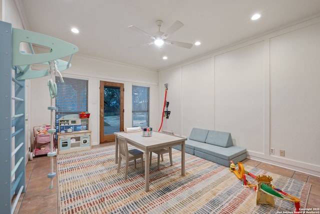 game room with ornamental molding, ceiling fan, and tile patterned flooring