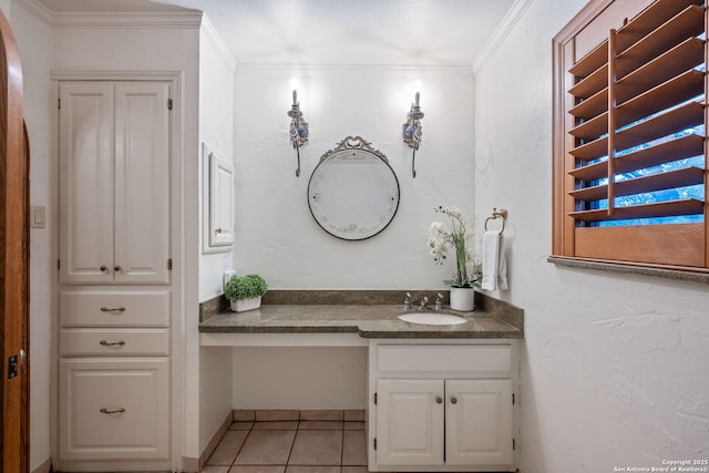 bathroom featuring ornamental molding, vanity, and tile patterned flooring