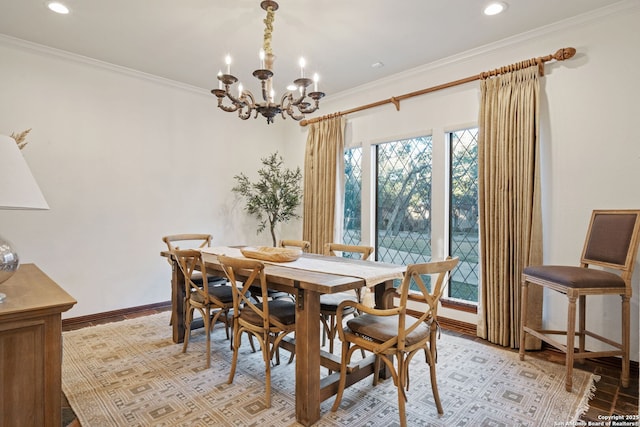 dining area with ornamental molding and light wood-type flooring