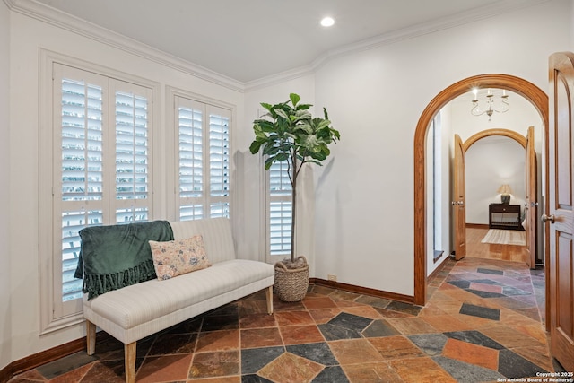 living area featuring crown molding