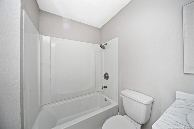 full bathroom featuring shower / bathing tub combination, vanity, and toilet