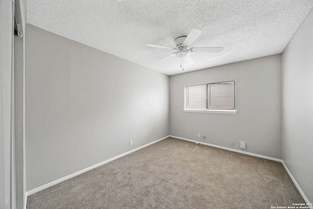 carpeted empty room featuring a textured ceiling and ceiling fan