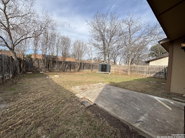 view of yard featuring a storage unit and a patio area