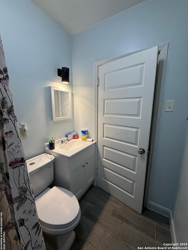 bathroom with vanity and toilet