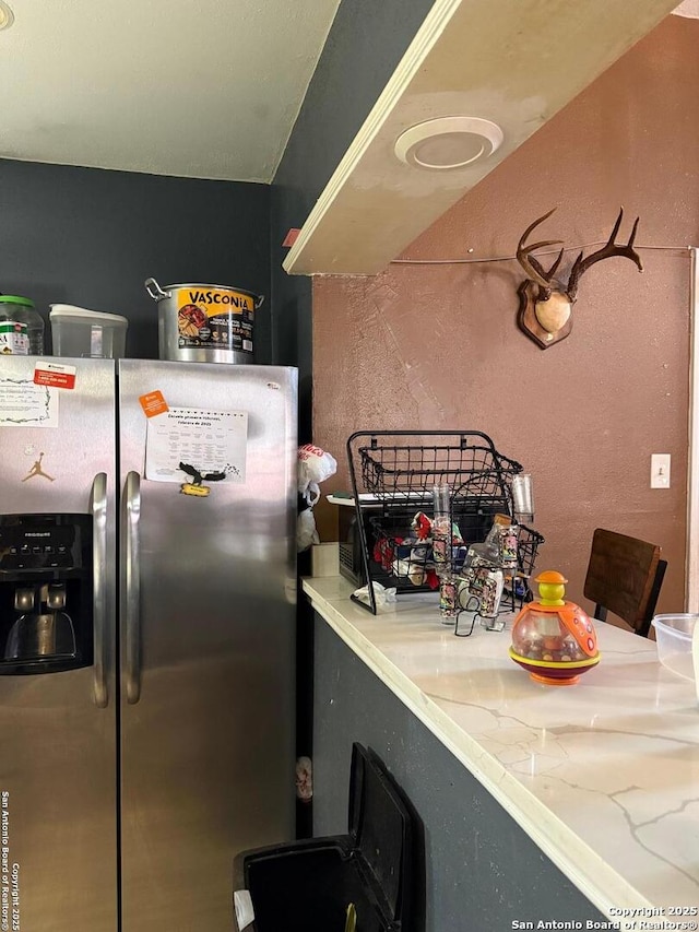 kitchen with stainless steel refrigerator with ice dispenser