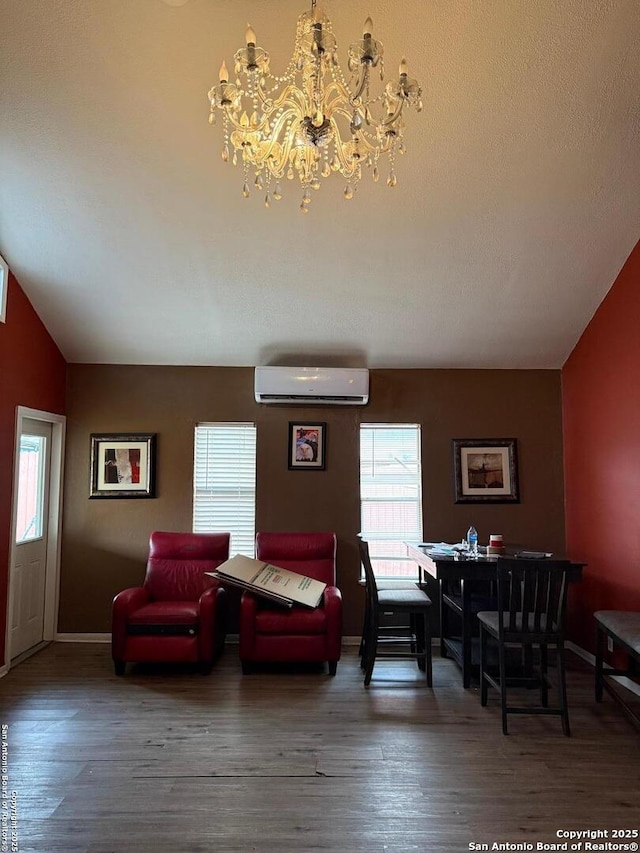 living room featuring lofted ceiling, a wall mounted air conditioner, and dark hardwood / wood-style flooring