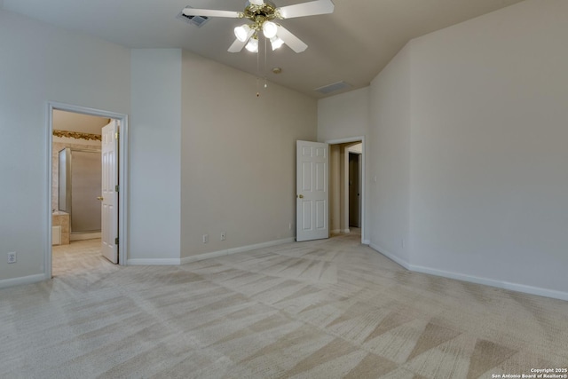 carpeted spare room featuring high vaulted ceiling and ceiling fan