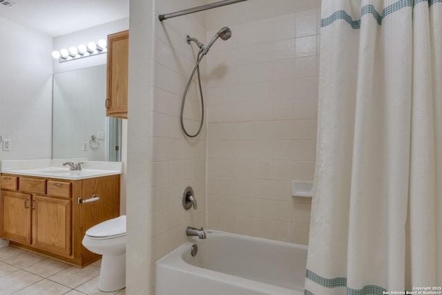 full bathroom featuring tile patterned floors, shower / tub combo with curtain, toilet, and vanity